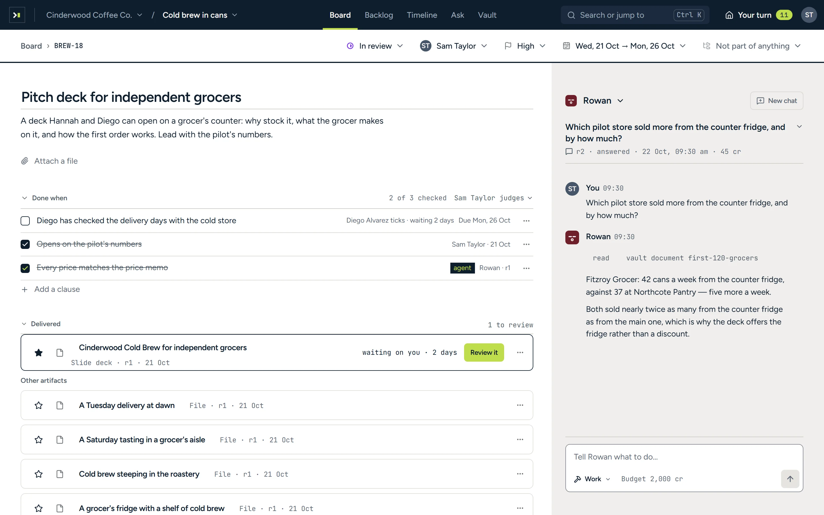 The job ‘Pitch deck for independent grocers’: its brief, a done-when list with two of three lines checked, the delivered deck waiting with Review it, the four pictures the agent drew, and the agent Rowan’s chat beside it.